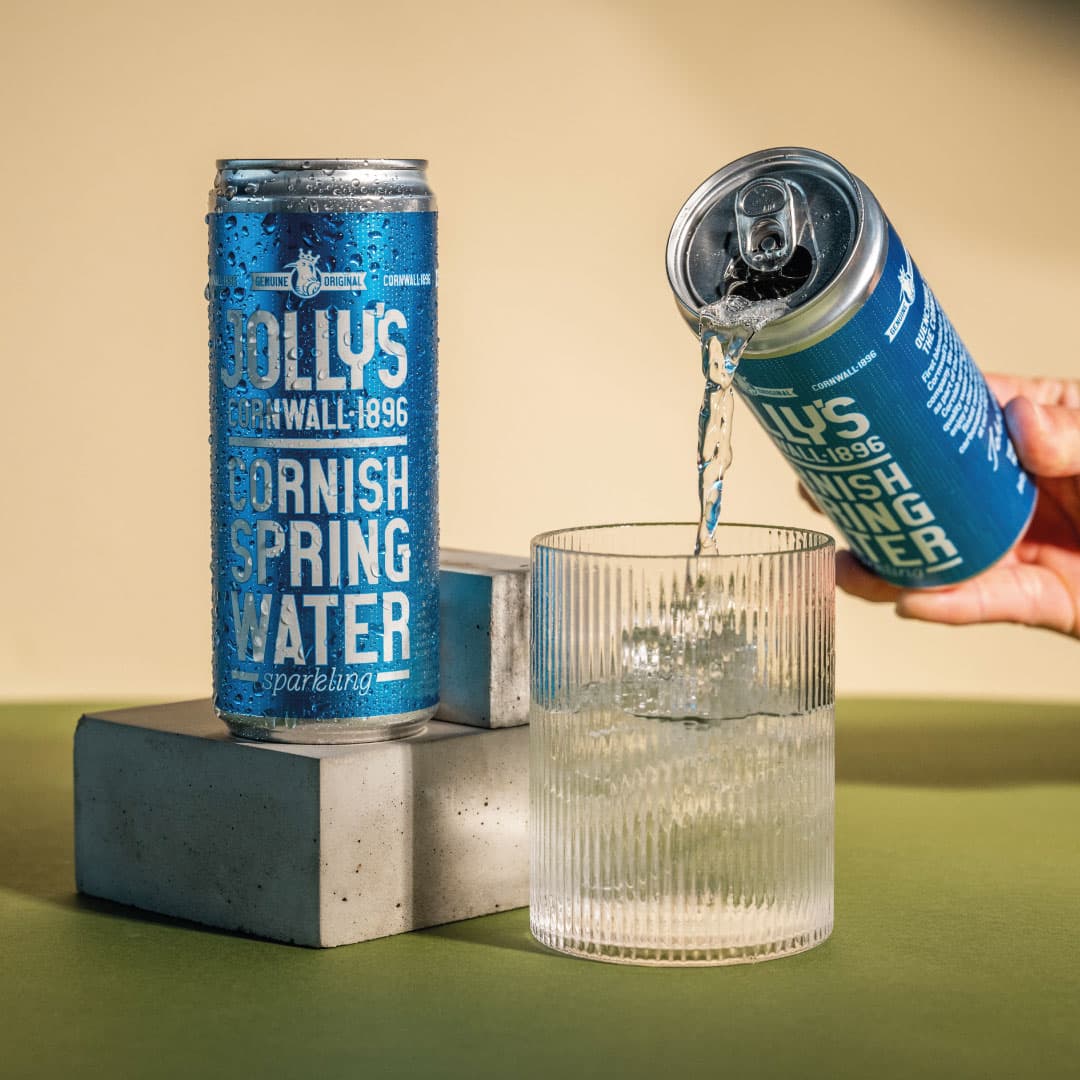 Jolly's Cornish sparkling spring water poured from a can into a glass