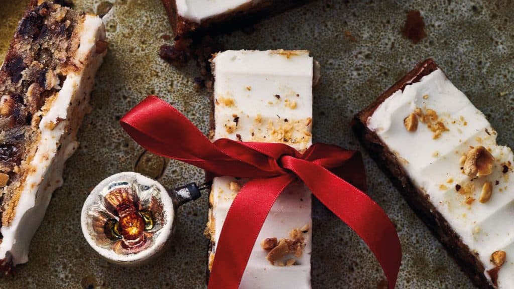 Iced Christmas cake slices tied with a red ribbon