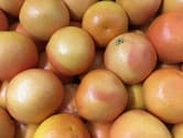 Pile of pink grapefruit