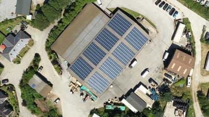 Aerial view of a depot with solar panels covering its roof
