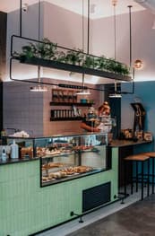 Café deli counter with pastries in a glass cabinet