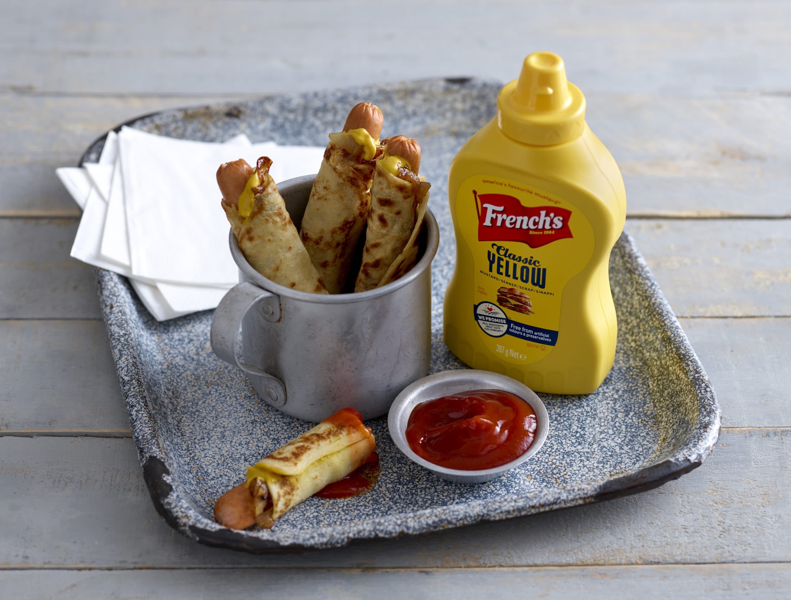 Pigs in blankets with French's mustard and ketchup